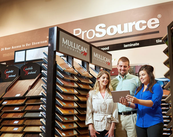 A couple looking at floor samples